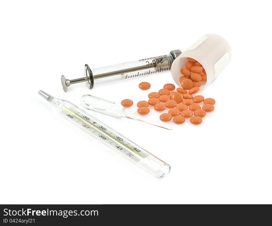 Syringe, ampoule,thermometer and pills on a white background