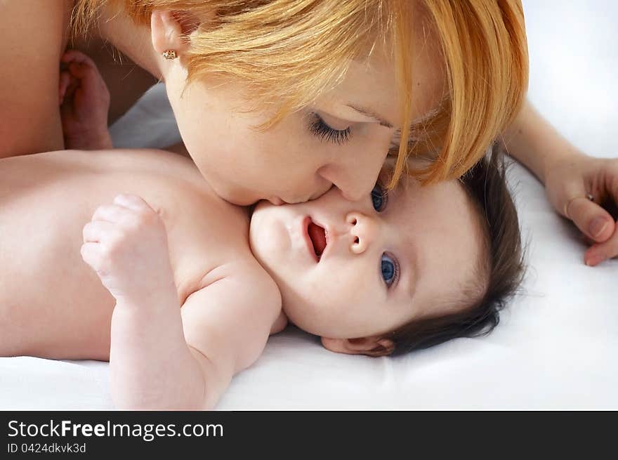 Portrait  Happy Mother And The Little Cute Baby