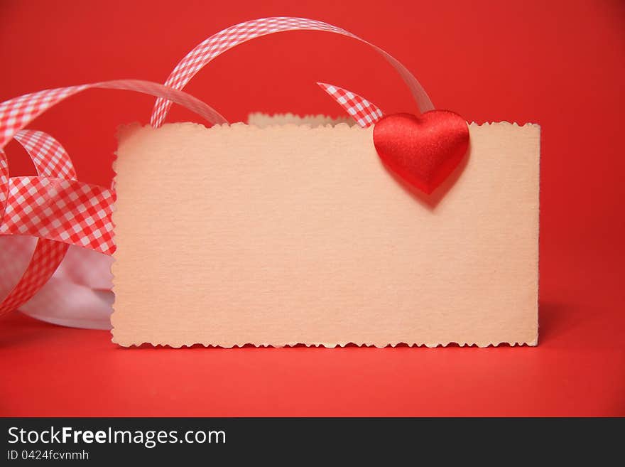 Red heart on the card, valentine, red background. Red heart on the card, valentine, red background