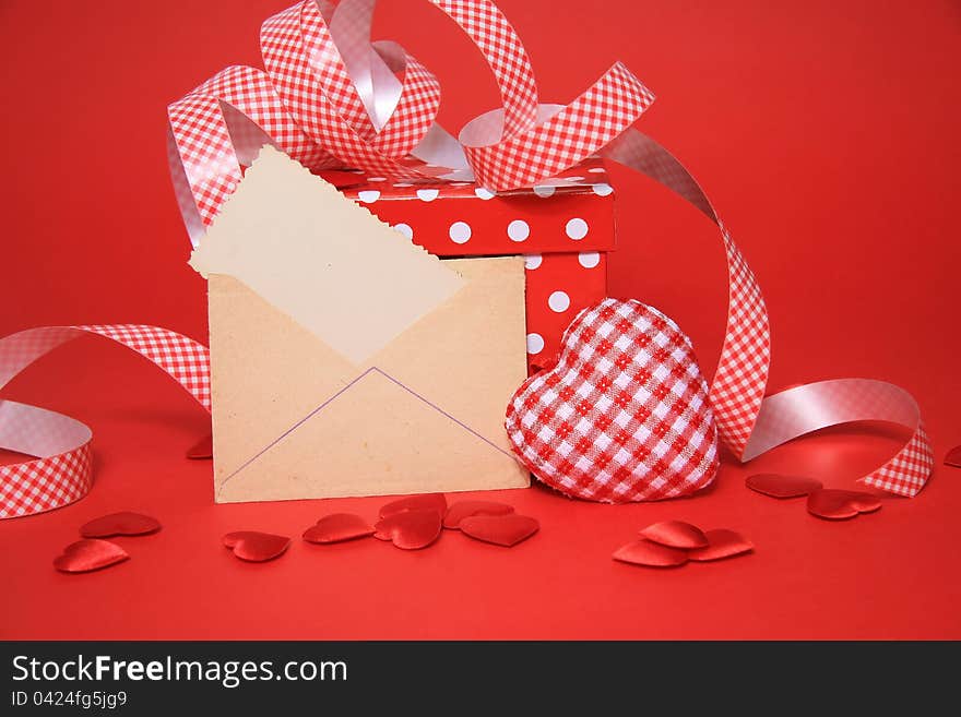 Blanc envelope, gift box with heart on red. Blanc envelope, gift box with heart on red