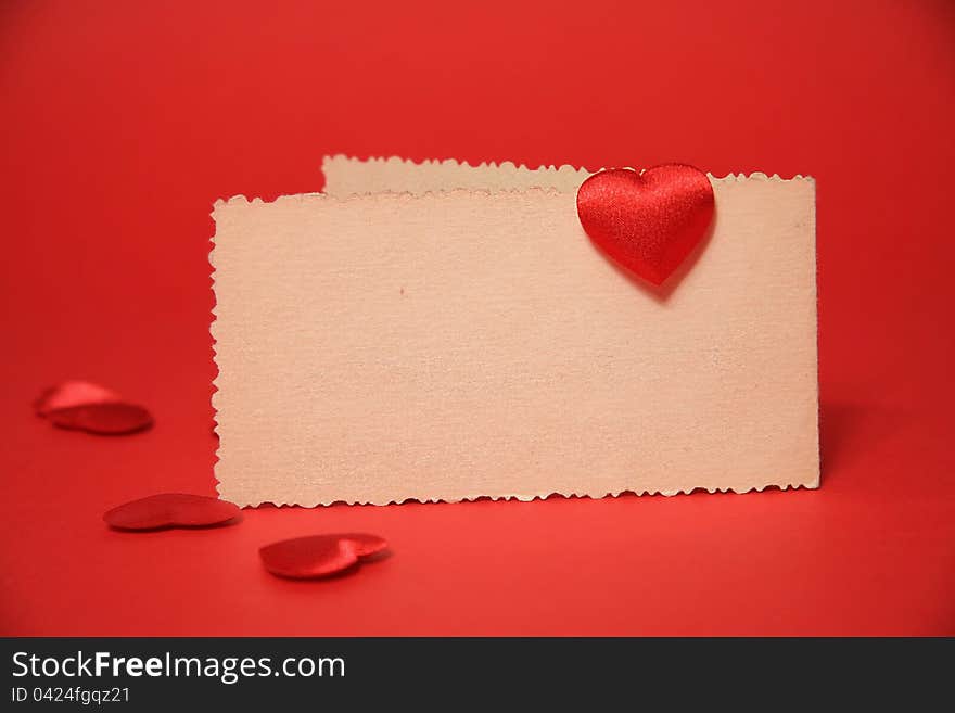 Red heart on the card, valentine, red background. Red heart on the card, valentine, red background