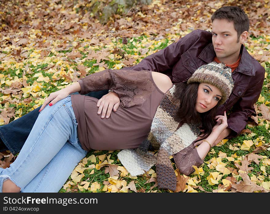 Couple Cuddling in Grass