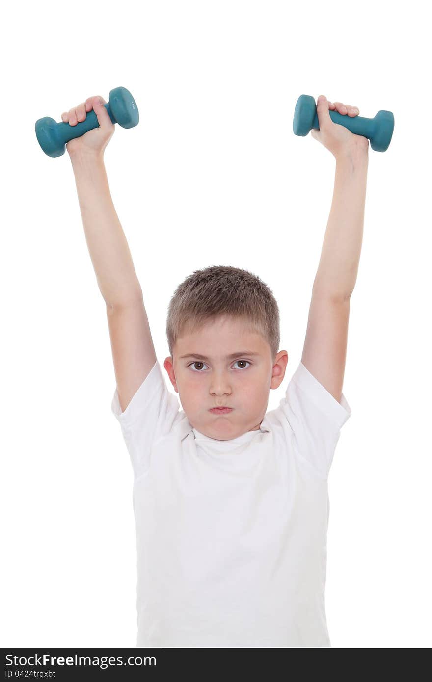 A boy doing sports with dumbbells. A boy doing sports with dumbbells