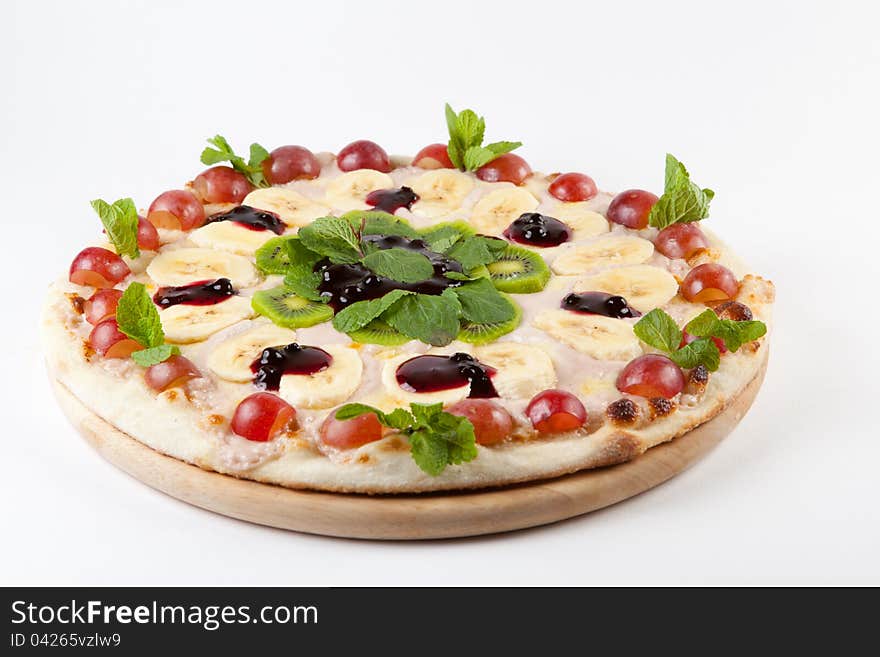 Sweet fruity round pizza on a white. Sweet fruity round pizza on a white