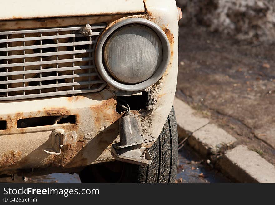 Trash destroyed old car in the street. Trash destroyed old car in the street