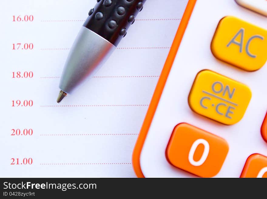 Calculator and pen with paper. Calculator and pen with paper