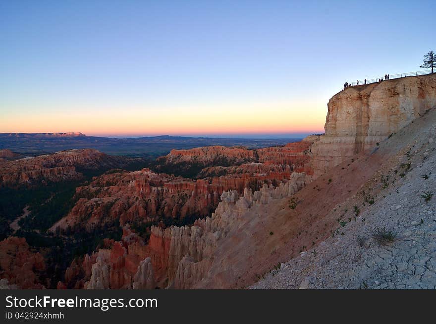 Visitors to Bryce Canyon enjoy a beautiful sunset from the park\'s highest overlook. Visitors to Bryce Canyon enjoy a beautiful sunset from the park\'s highest overlook.