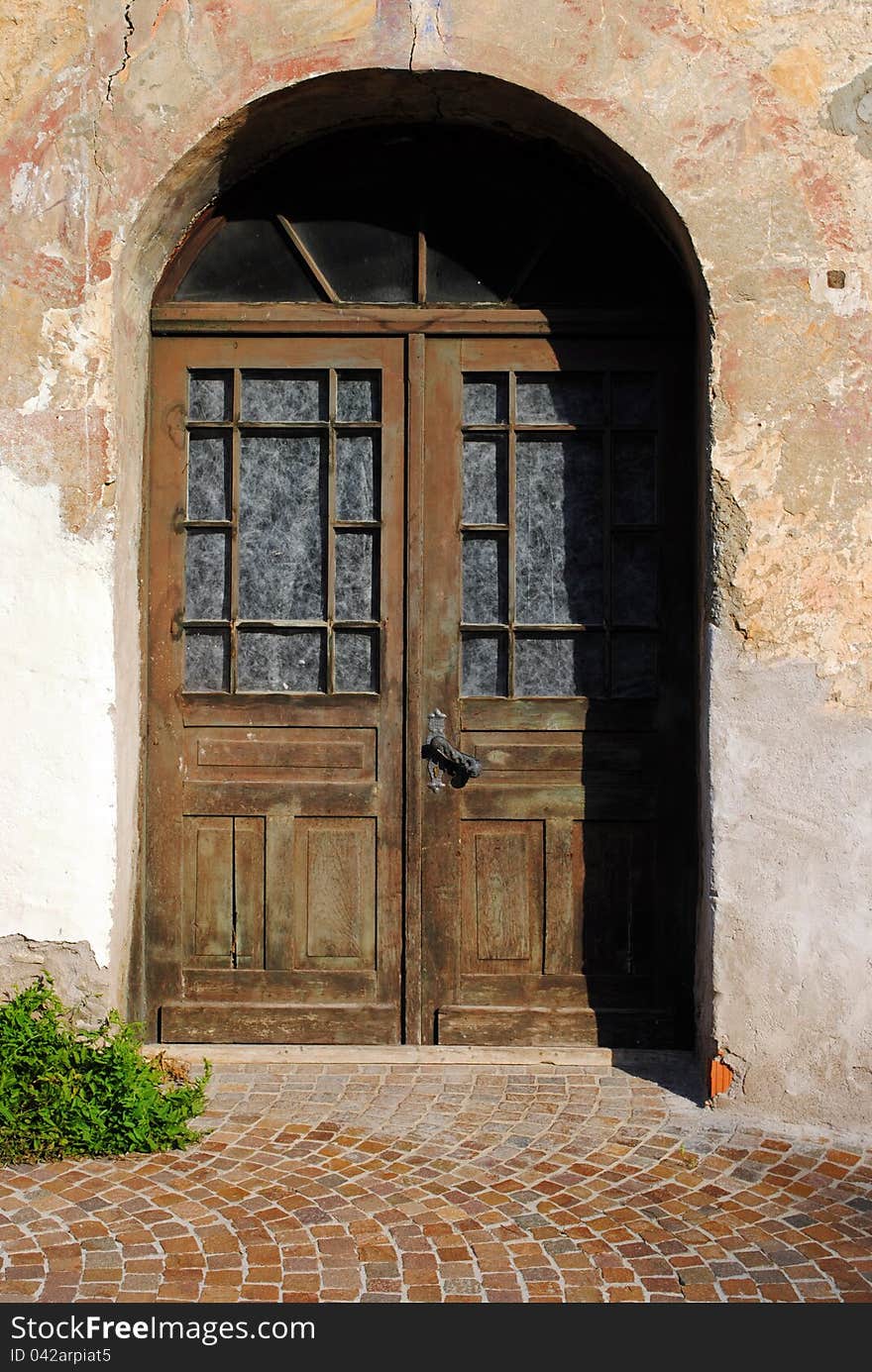 Old door made of wood, iron and glass