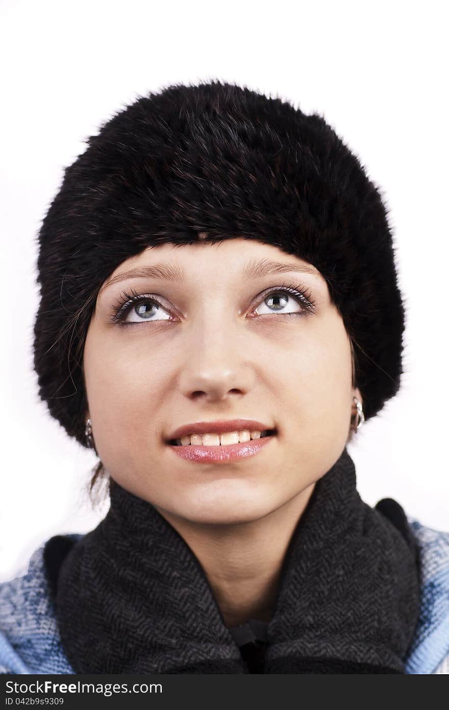 Young Smiling Woman In Cap Looking Up