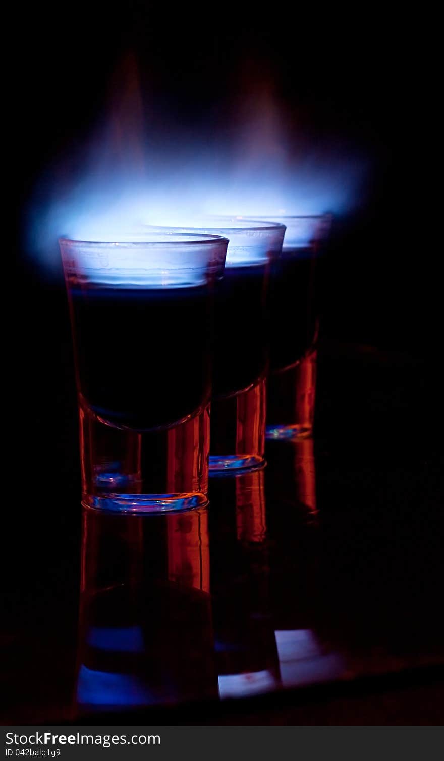 Burning drink in shot glass