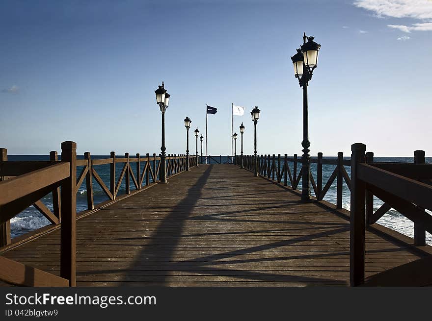 A wood pier in Marbella (Costa del Sol), Spain. A wood pier in Marbella (Costa del Sol), Spain