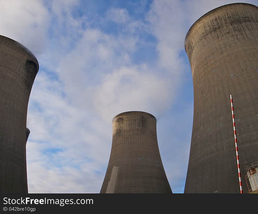 Cooling towers looming up int the sky. Cooling towers looming up int the sky