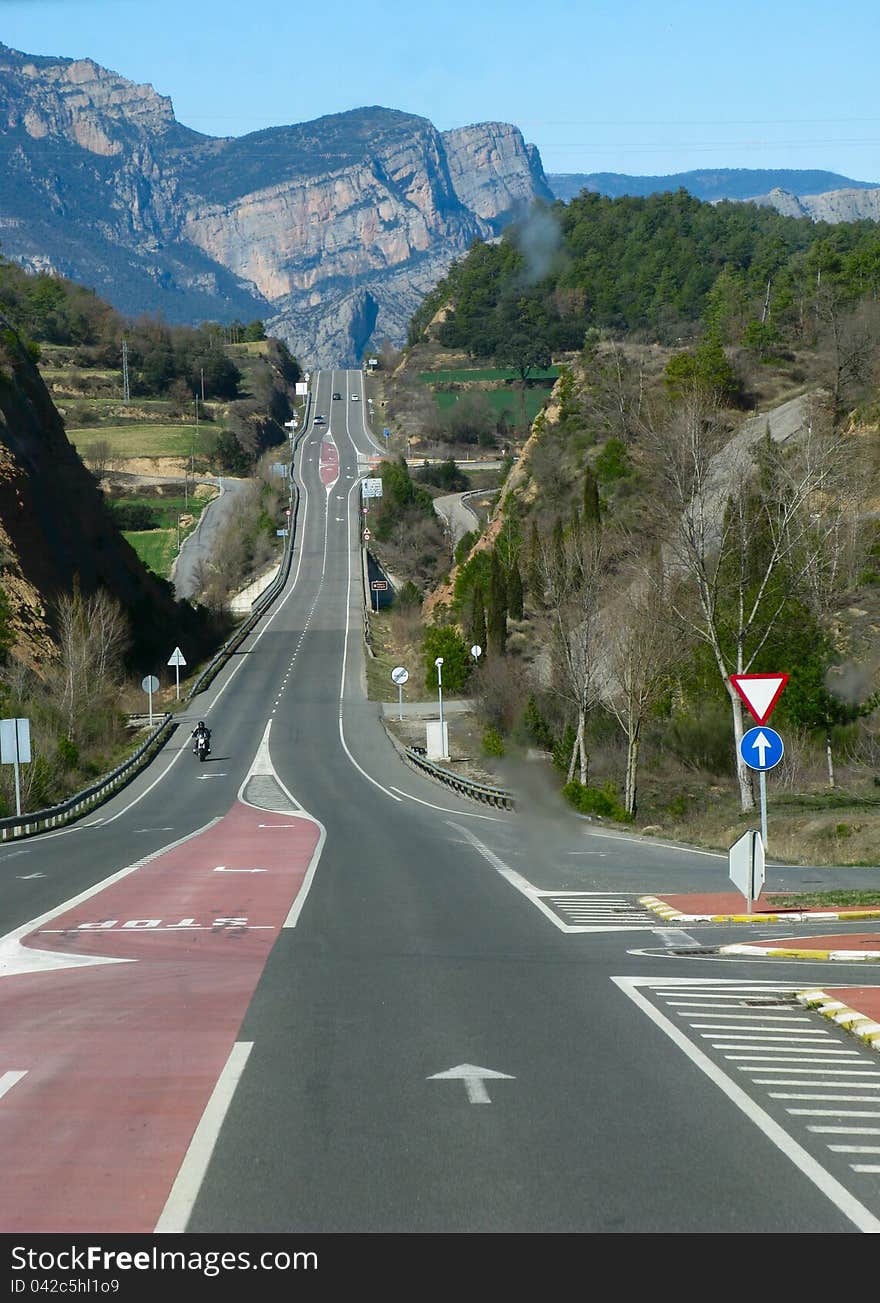 The highway goes upwards to mountains. The highway goes upwards to mountains