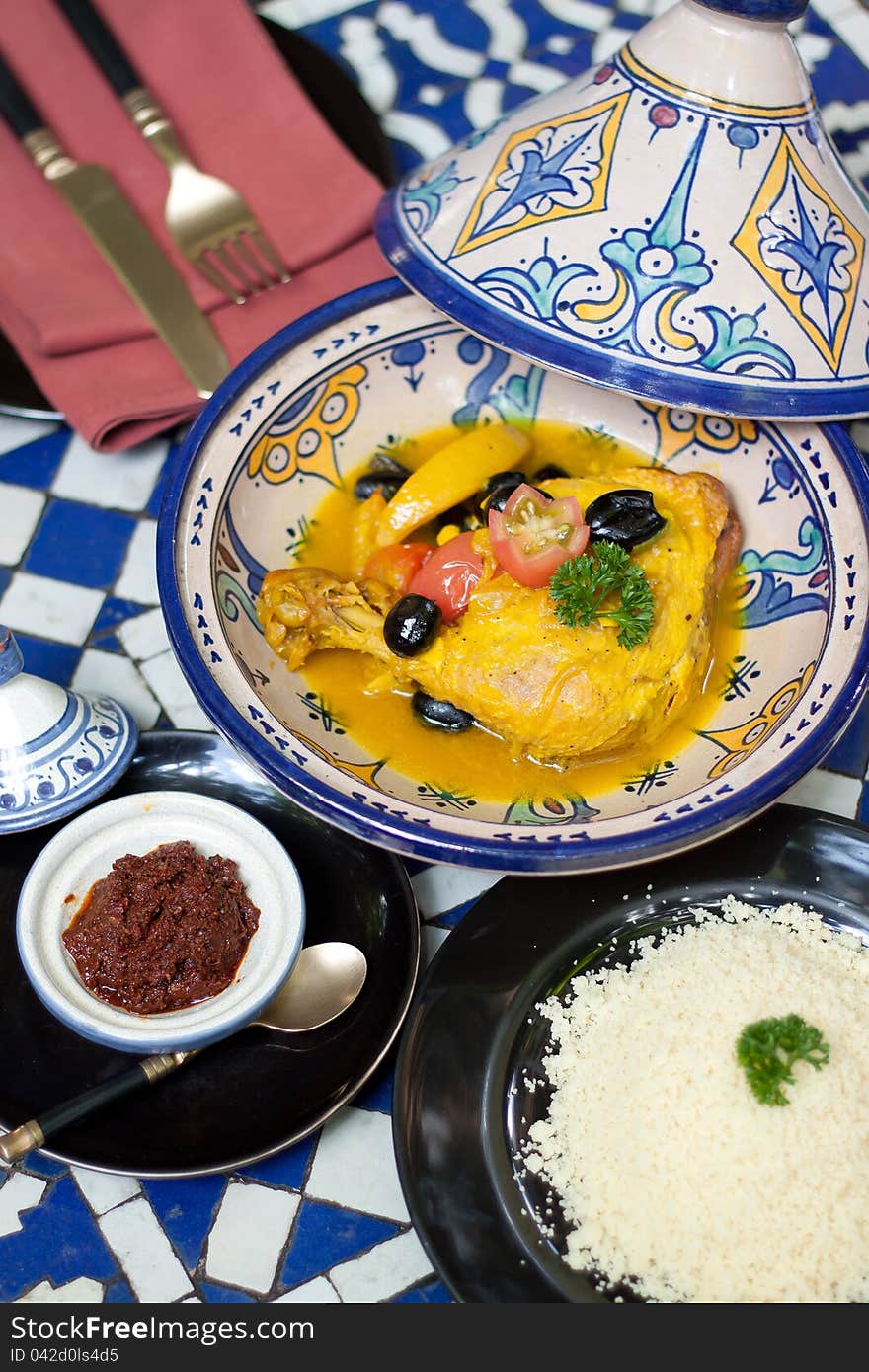 Yellow chicken curry with rice and dip in the restaurant