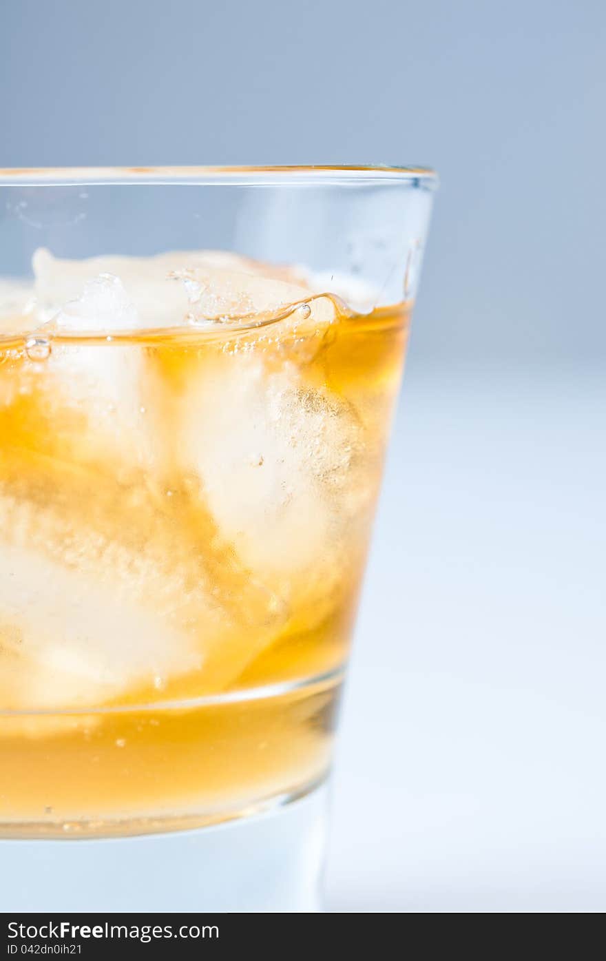 Close-up of a glass of cold drink with ice