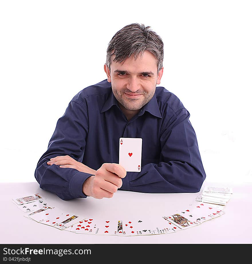 Card player sitting at the table with cards in hand