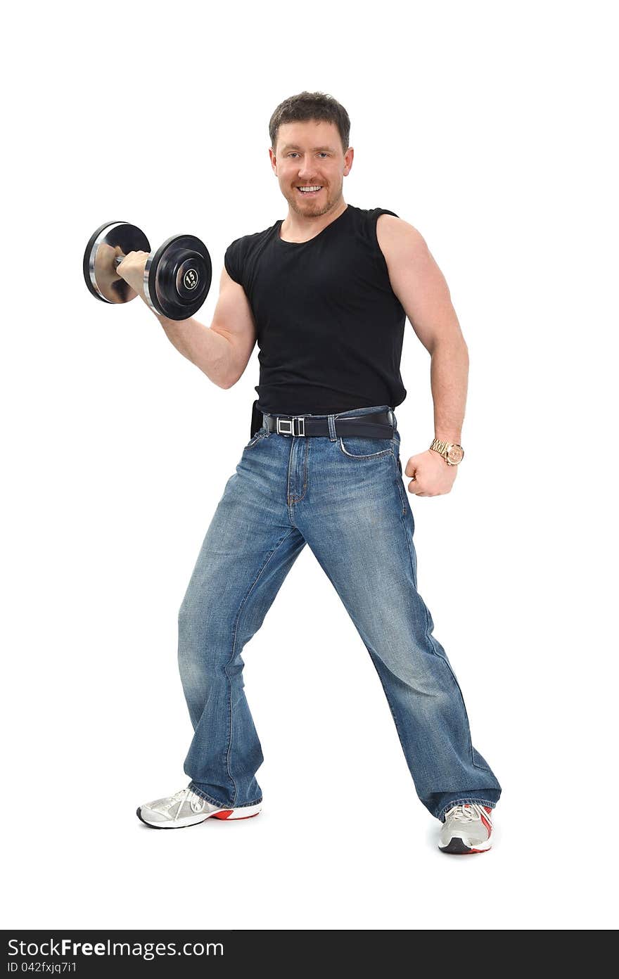 Man staying with dumbbell and smiling, on white background