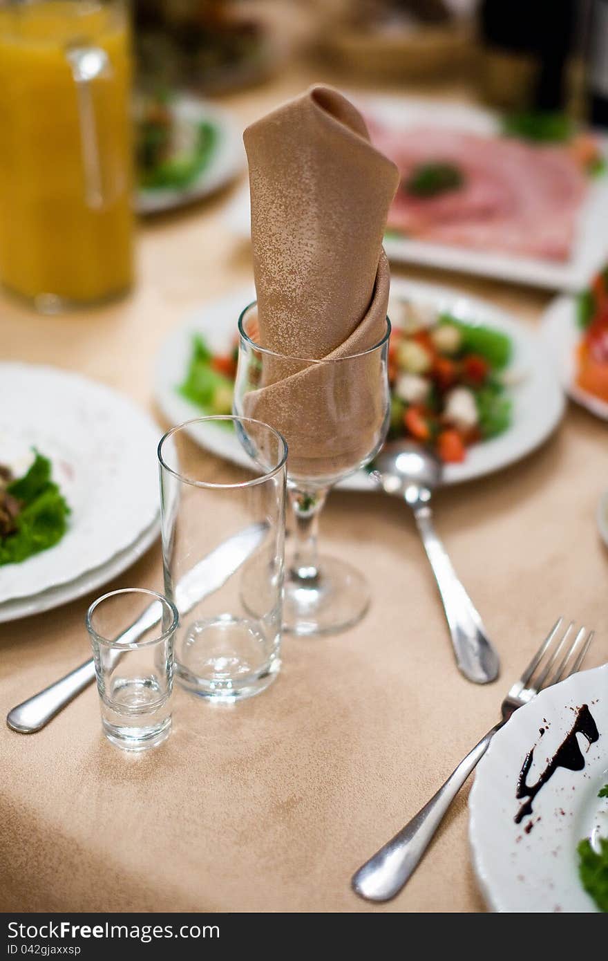 Table with wineglass and napkin in restaurant