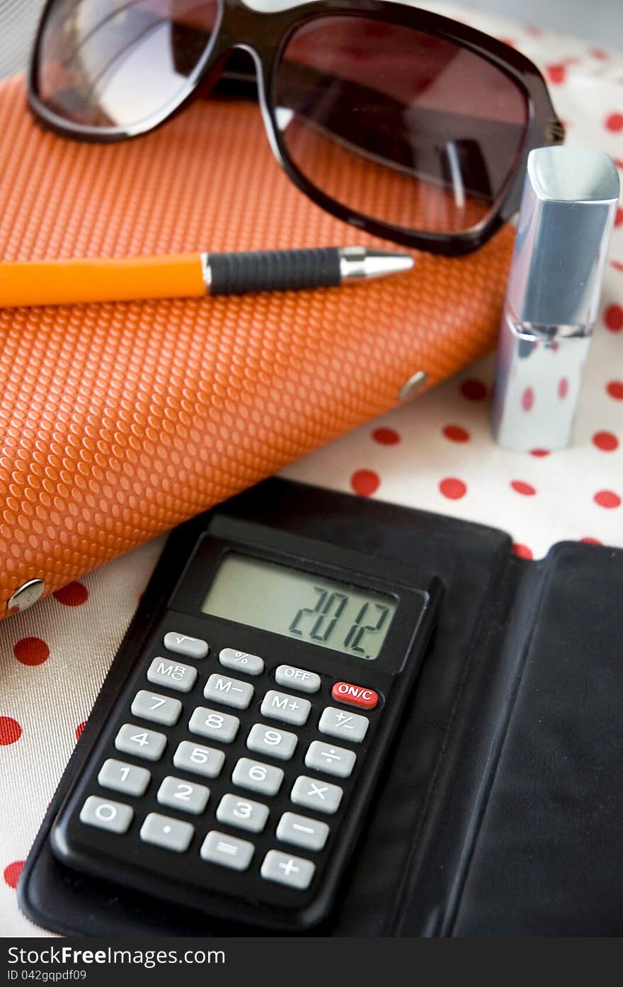 Close up calculator on working table lady style. Close up calculator on working table lady style