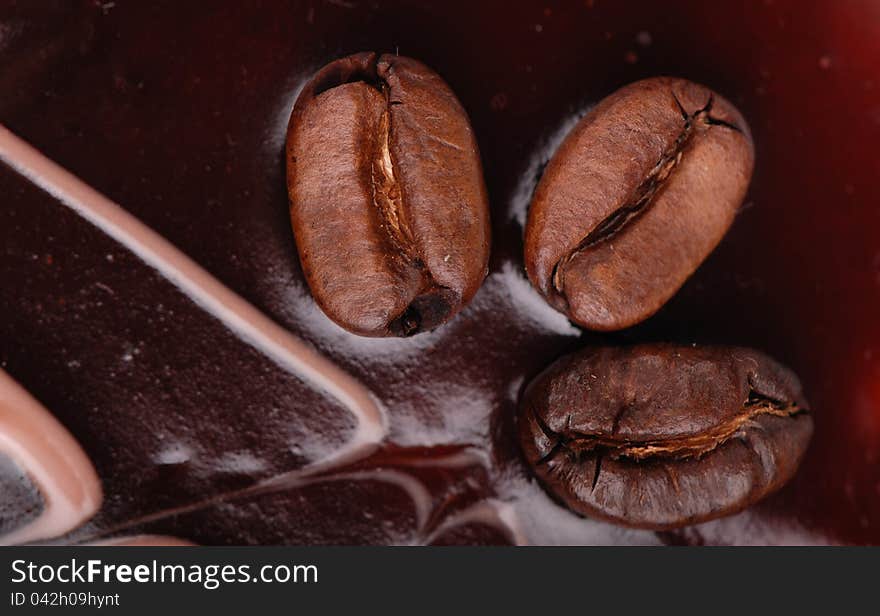 Macro shoot of Coffee cake with three coffee beans background. Macro shoot of Coffee cake with three coffee beans background