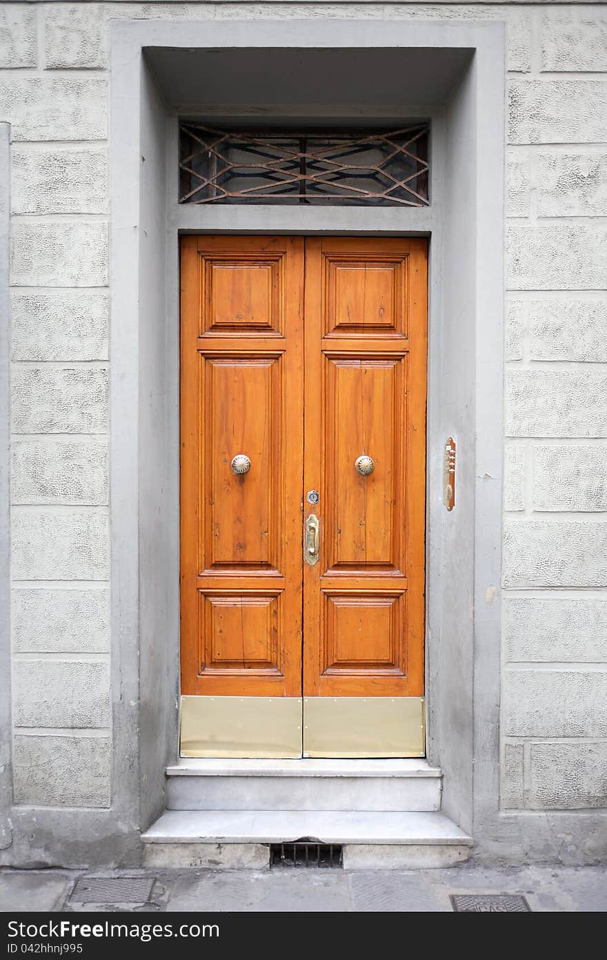 Fragment of old stone building with nice wooden door. Fragment of old stone building with nice wooden door