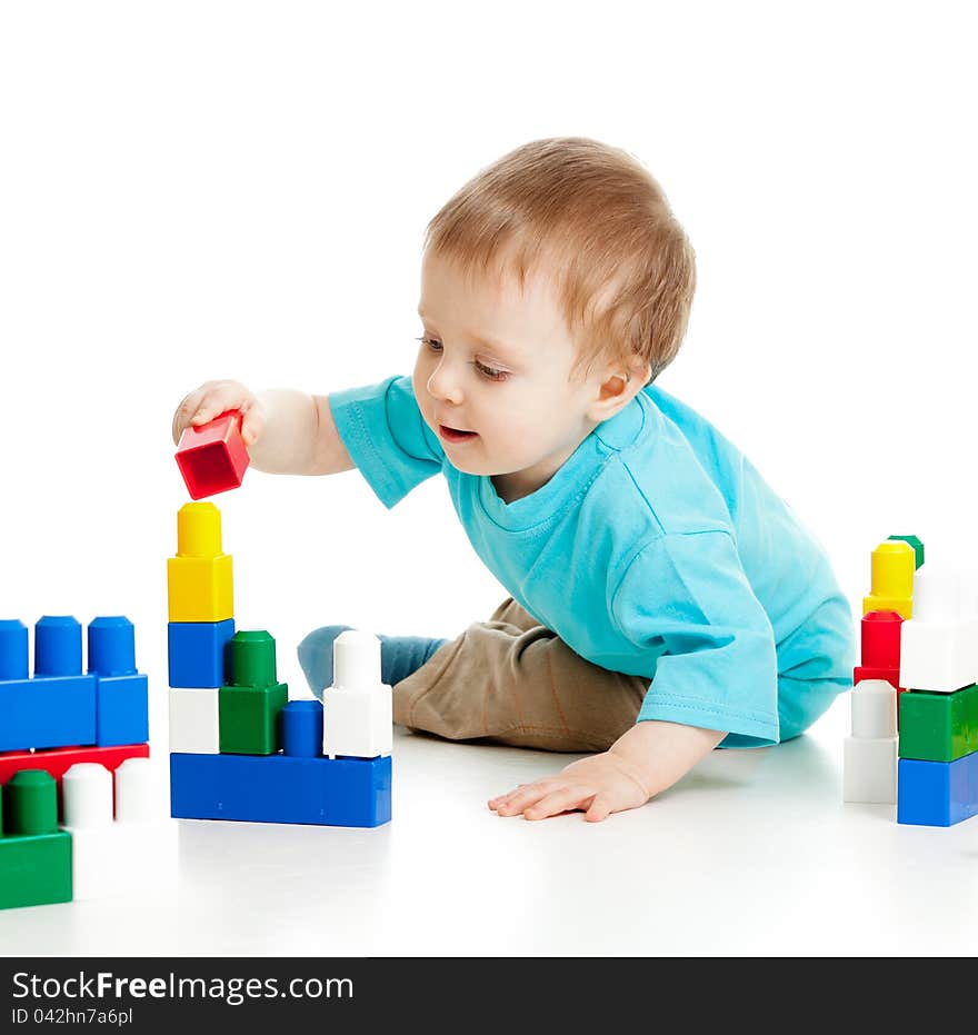 Cheerful Child With Construction Set Over White