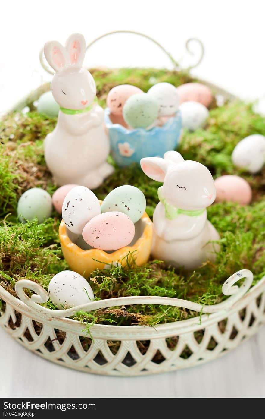 Easter decoration with bunny and chocolate eggs on moss. Easter decoration with bunny and chocolate eggs on moss