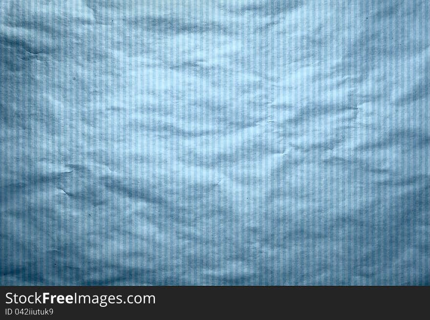 It is a texture of an old paper in a blue strip. A background in style of a retro