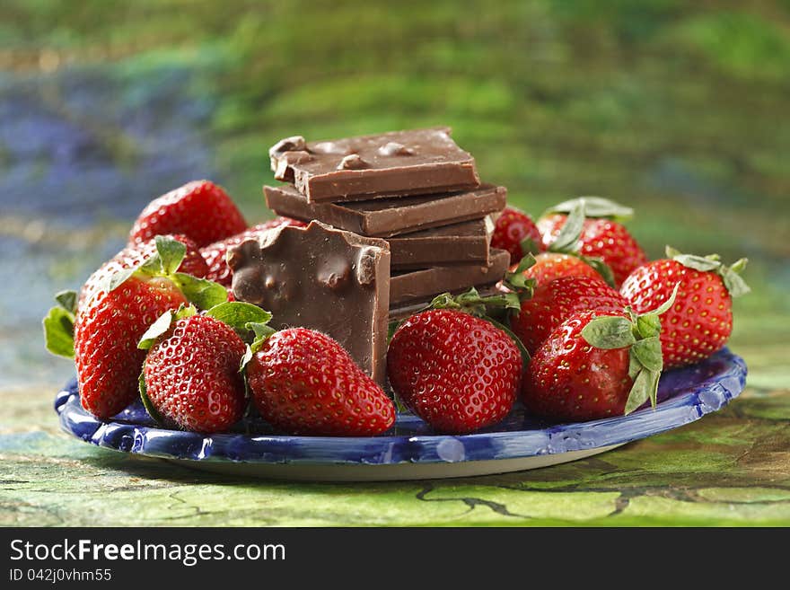 Sliced strawberries arranged and photographed on a black surface