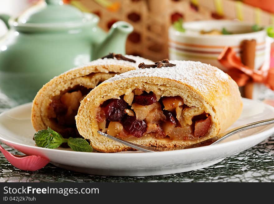 Slice of an apple strudel with fresh ingredients. Slice of an apple strudel with fresh ingredients