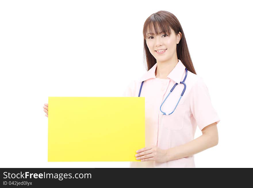 Young japanese female nurse holding a blank board