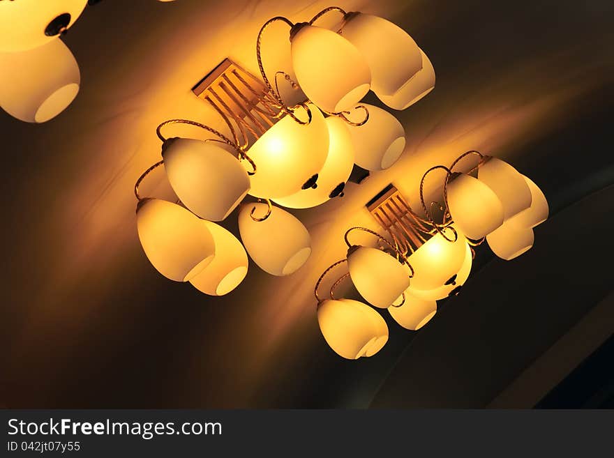 The close-up of chandelier lamps.