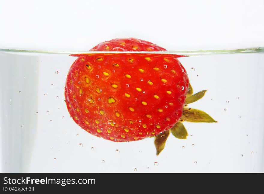 Strawberry closeup in the water. Strawberry closeup in the water