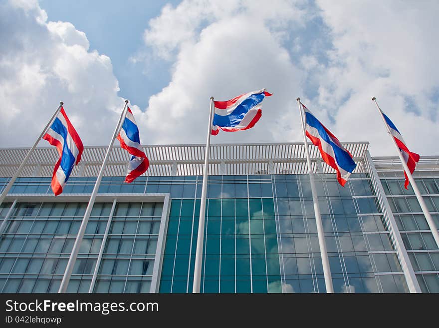 Thai national flags blowing in the wind in front of the building. Thai national flags blowing in the wind in front of the building