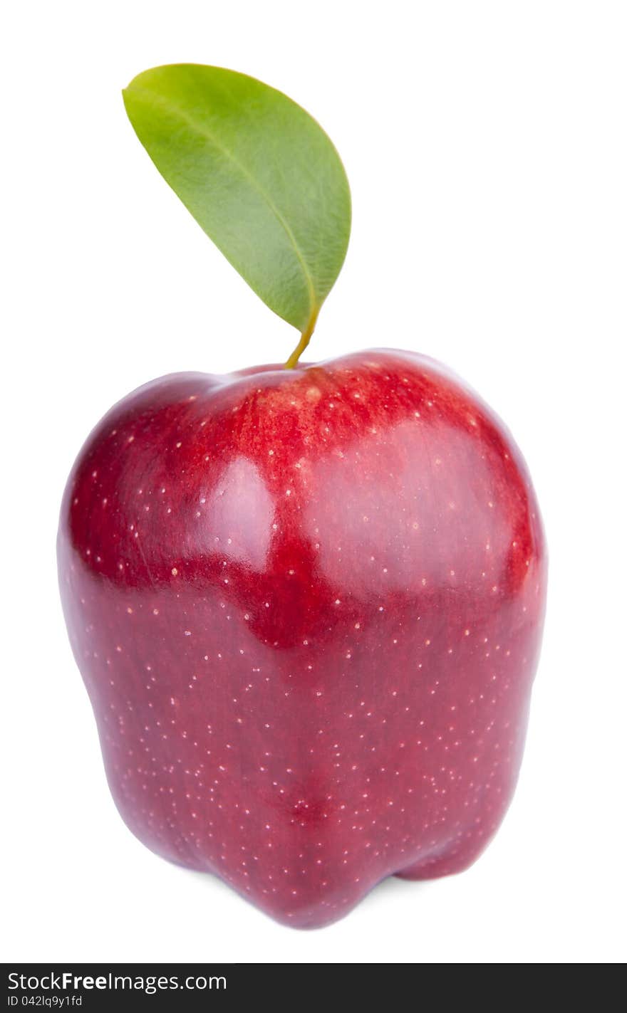 Red delicious apple with green leaf on white background