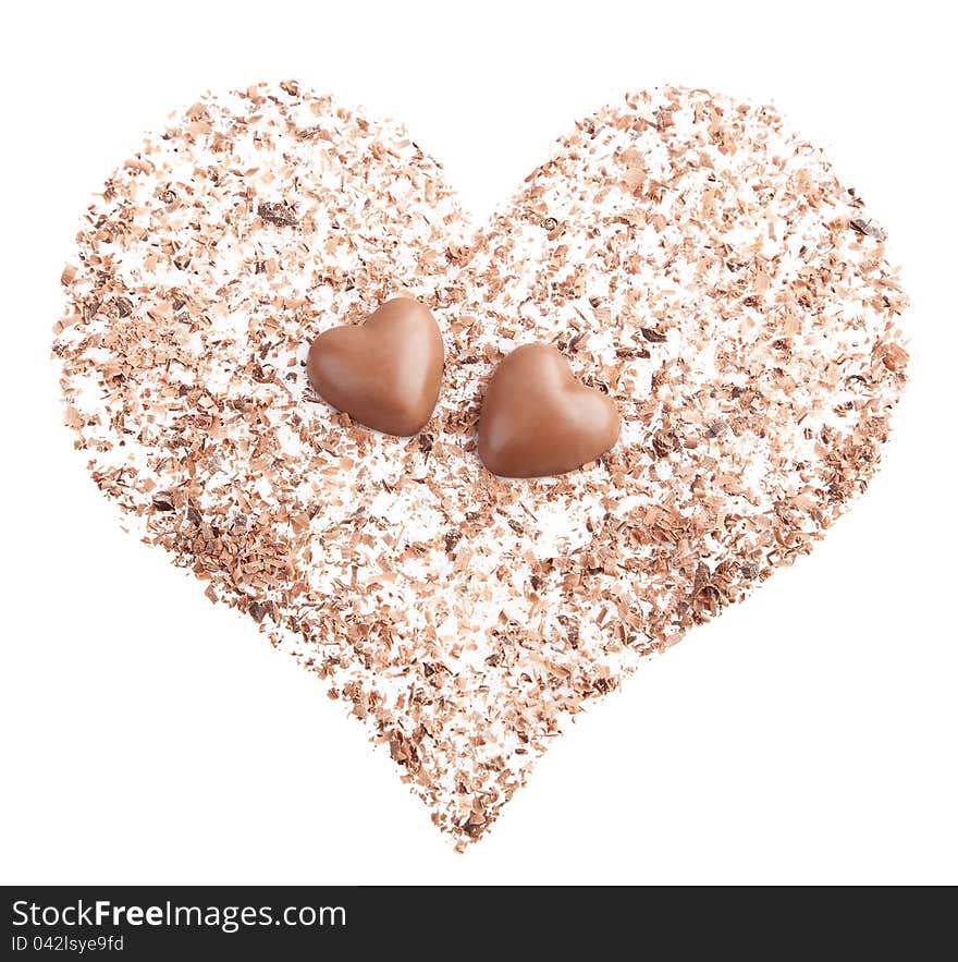 Chocolate hearts and chips on white background.