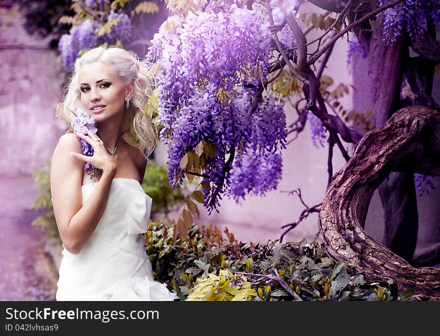 Beautiful bride with white hair walking in the park. Beautiful bride with white hair walking in the park