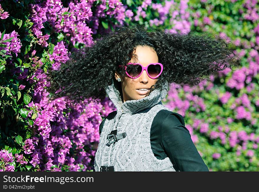 Funny black girl with purple heart glasses with purple flowers