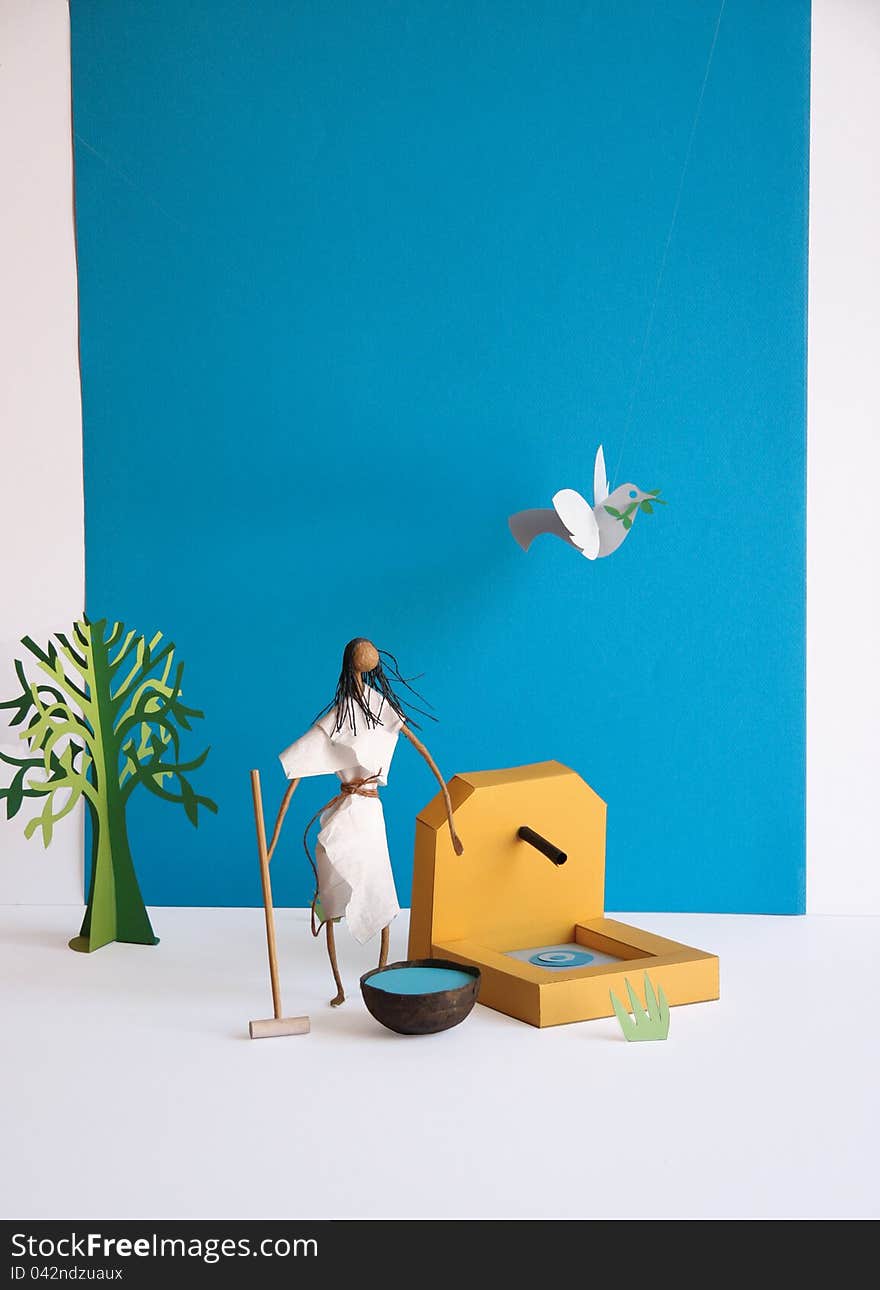 Japanese female figure and a peace dove made of paper