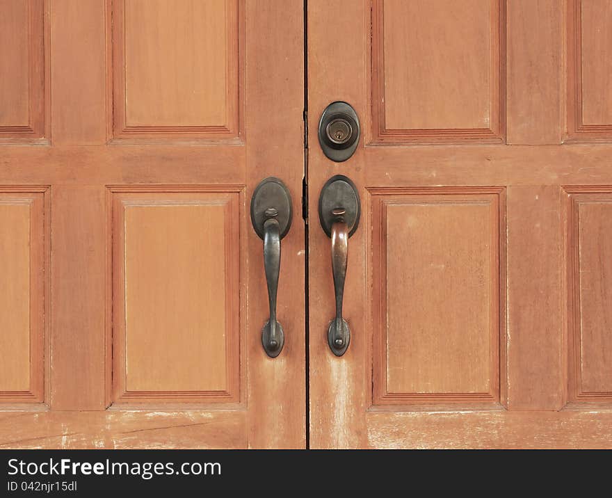 Old wooden doors with old metal handle. Old wooden doors with old metal handle