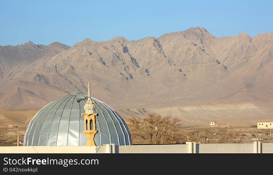 Mosque with a mountain range in the background