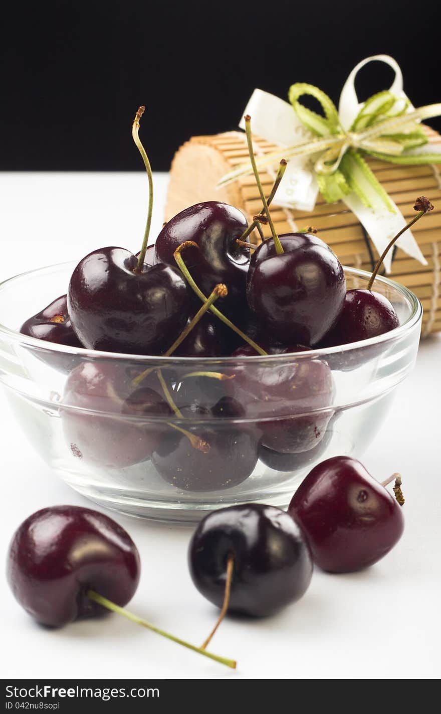 Ripe fresh cherry in the glass bowl