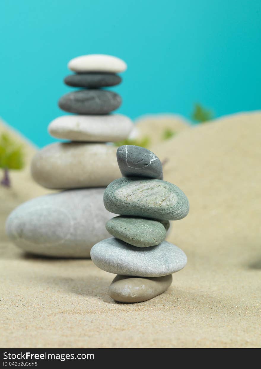 Zen rocks towers, in a sea shore miniature landscape, with water reflexion. Zen rocks towers, in a sea shore miniature landscape, with water reflexion