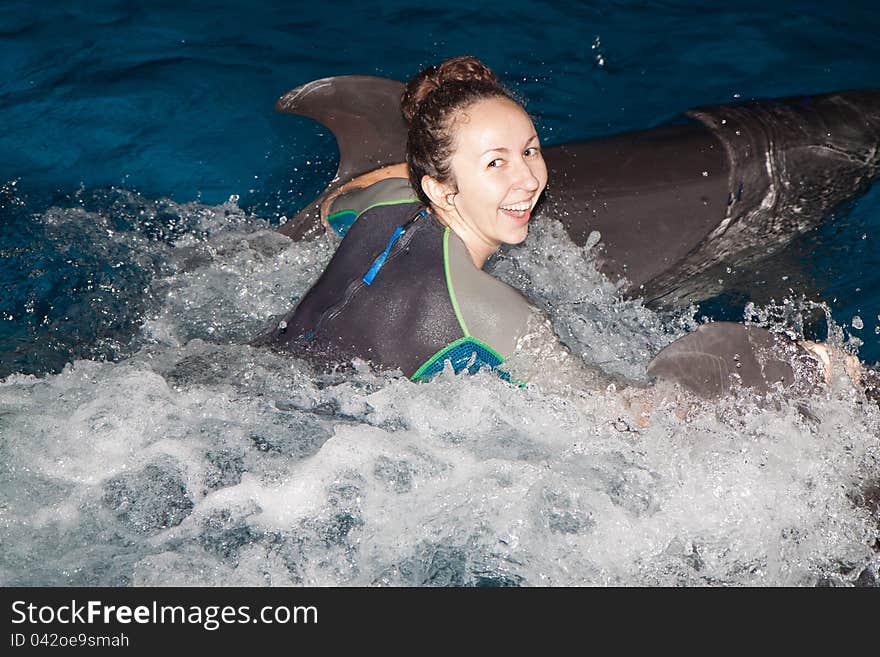 Happy girl and dolphin