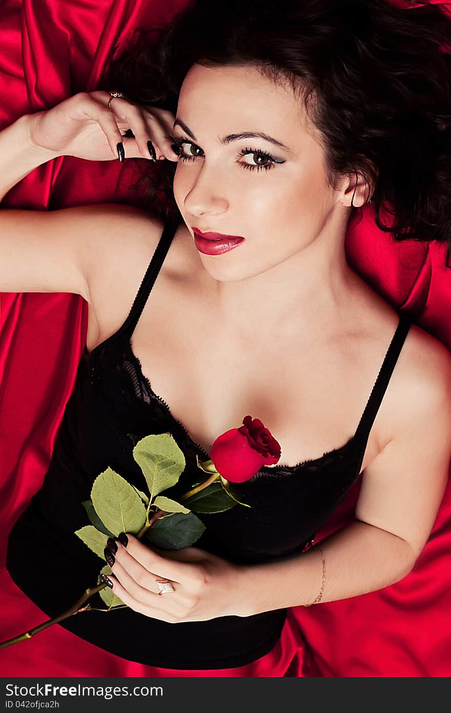 Beautiful brunette and red rose. Beautiful brunette and red rose