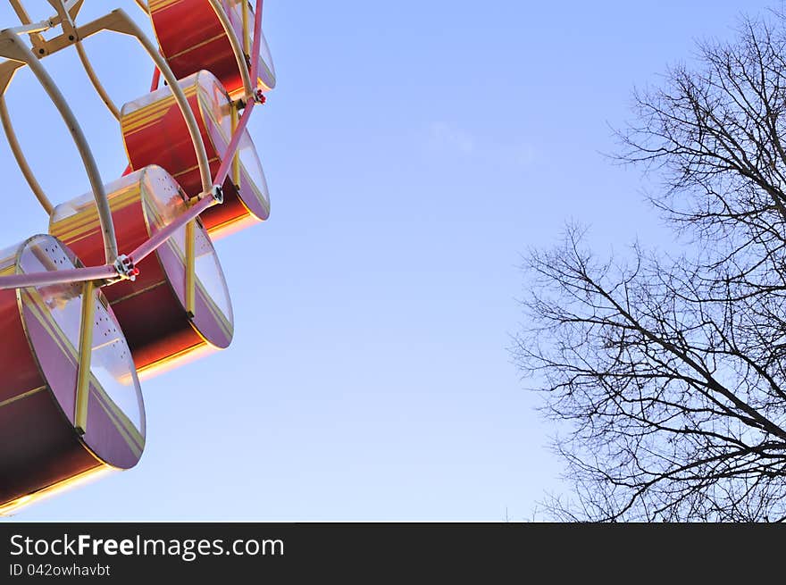 Passenger Cars on Big Wheel in Theme Park