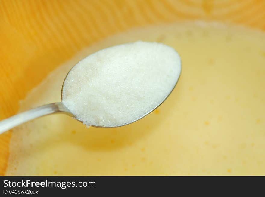 Sugar Being Added into Bowl with Whipped Eggs