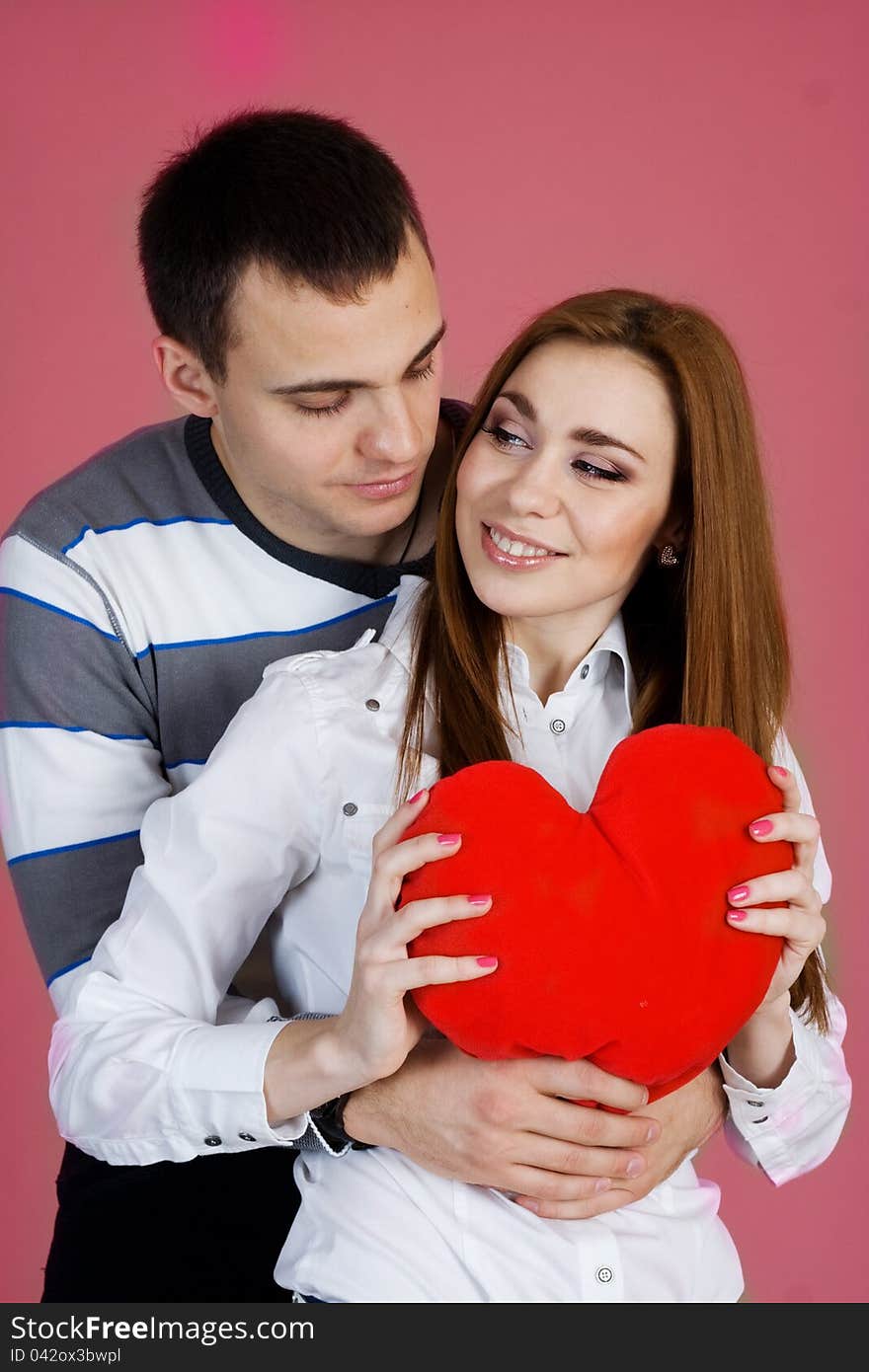 Young couple with red heart