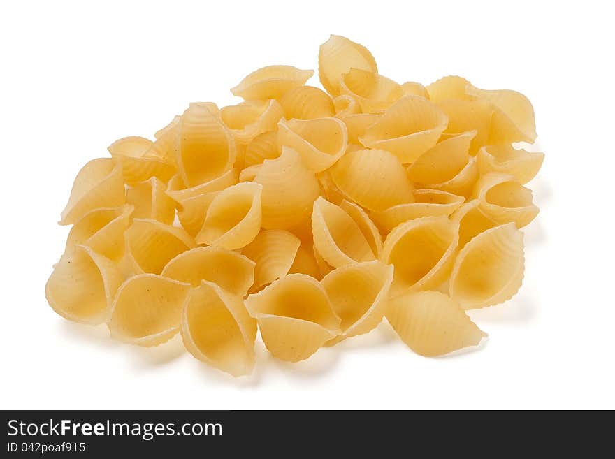 Shell-shaped pasta against white background