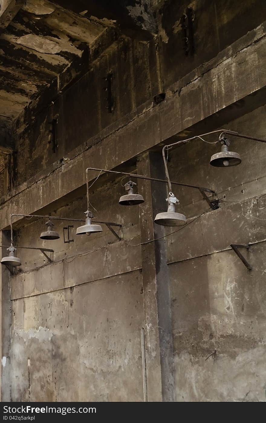 Old warehouse with rusty lamps and ruined walls. Old warehouse with rusty lamps and ruined walls